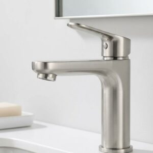A close-up view of a modern, water-saving brushed nickel faucet.